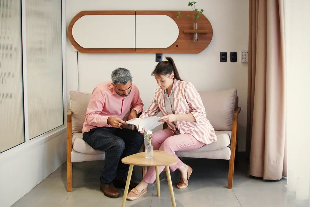 Our lawyer going through the programme documents with a client in our Tbilisi office